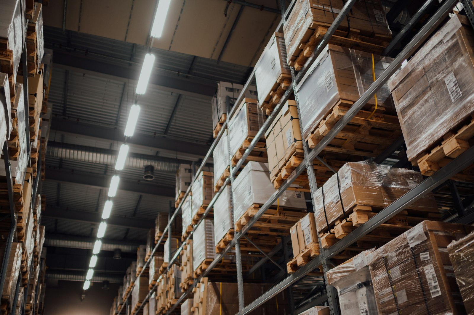 Warehouse pallet racking loaded to capacity with shrink-wrapped inventory, the point where Q4 overflow forces a storage decision