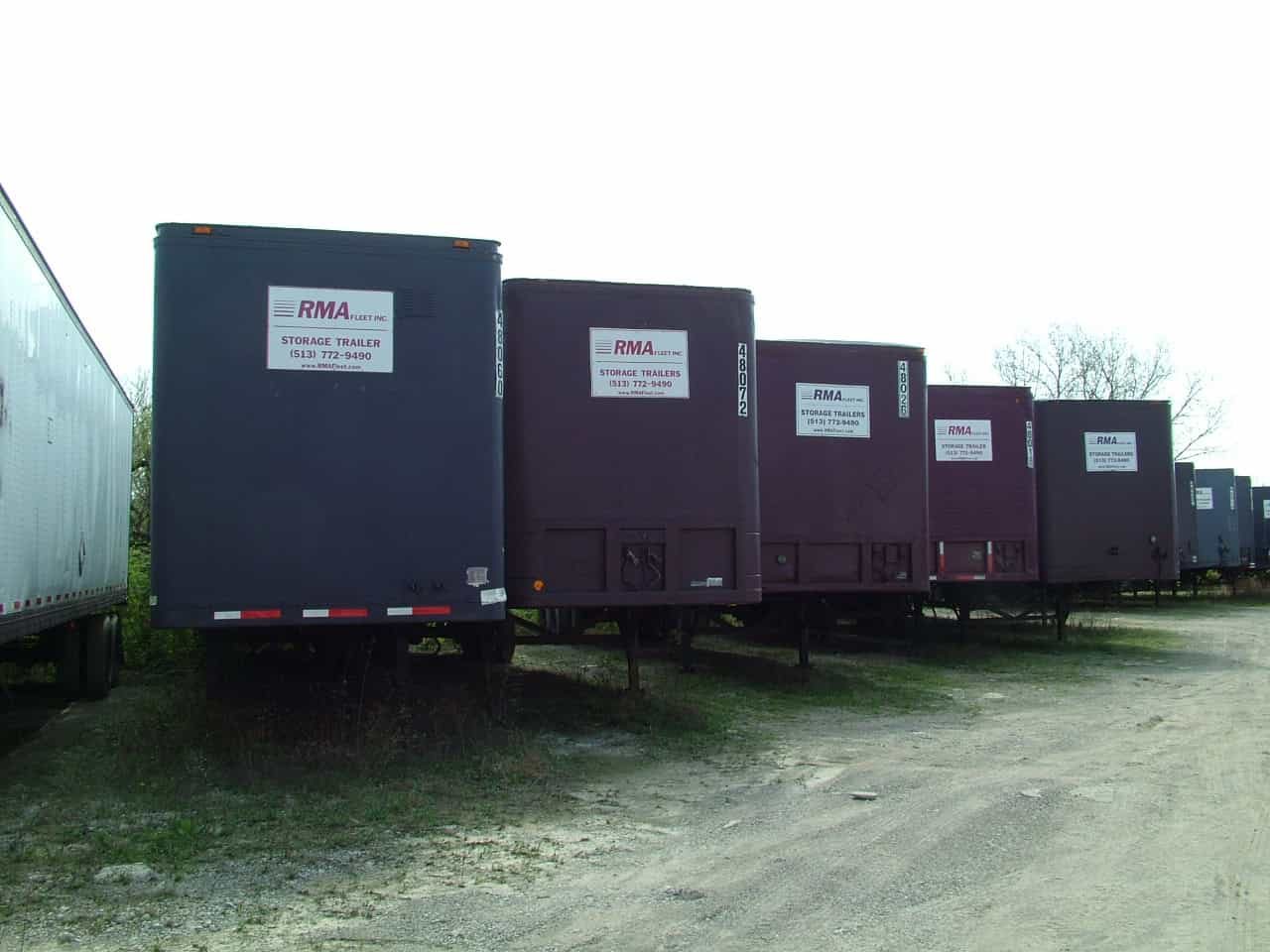 Row of RMA Fleet branded storage trailers staged in the rental yard near Cincinnati